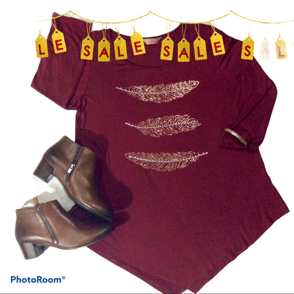 Women’s tunic, 3/4 sleeve with embellishments.